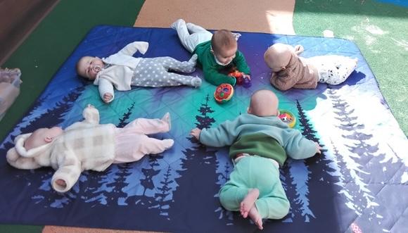 Dedicated infant program teacher at Wonder Years School providing nurturing care and early childhood education for babies aged 3-12 months